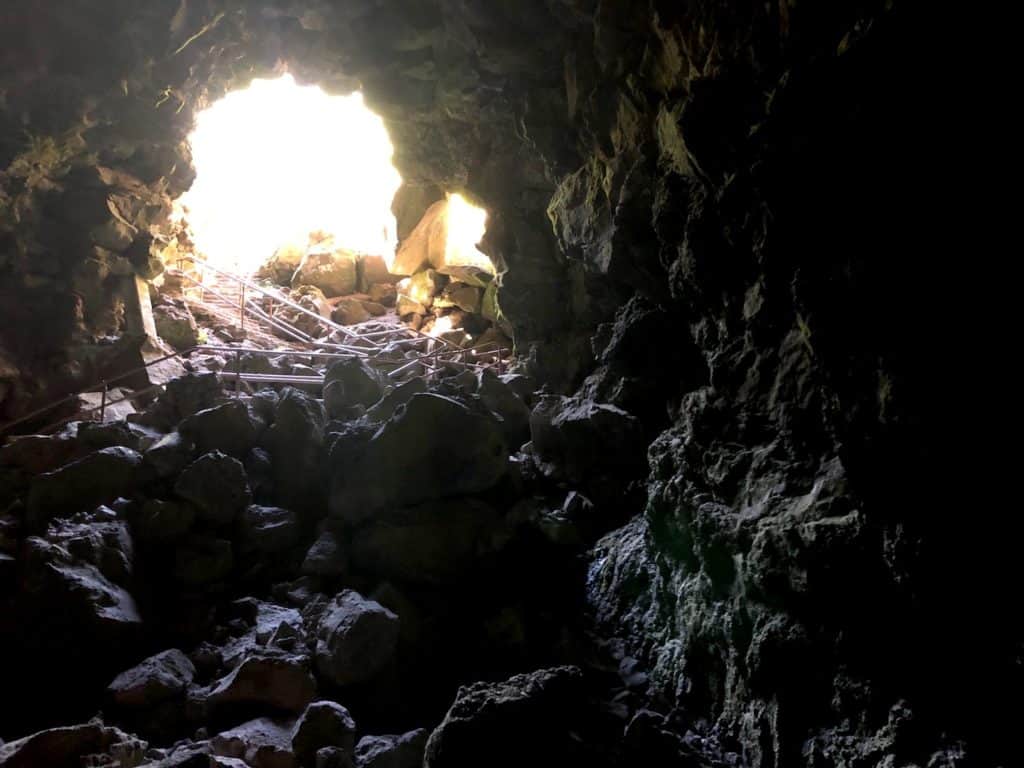 Planning travel to Central Oregon? Make sure to visit Lava River Cave, near Bend, OR, to hike in an underground lava tube! To & Fro Fam