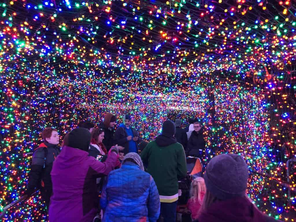 Looking for Portland holiday events? Going to the Portland ZooLights with kids at the Oregon Zoo is an unforgettable nighttime family activity! The light tunnel is gorgeous for family holiday photos. To & Fro Fam