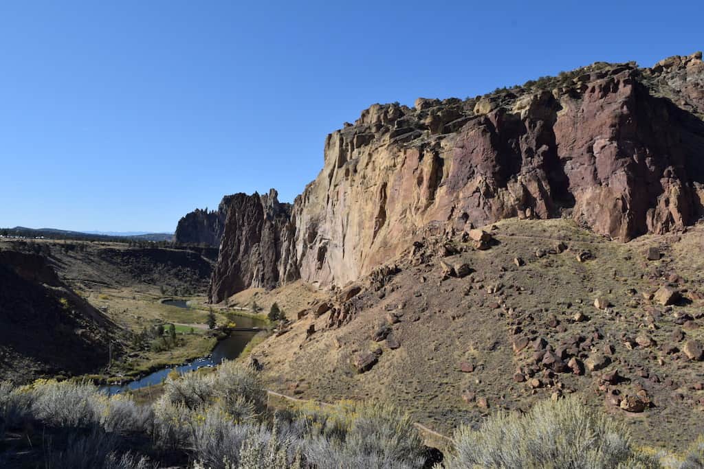 Smith Rock State Park's Misery Ridge Trail: One of the best things to do in Central Oregon. Near Bend, OR this moderate hike takes you to the top of these towering rocks and past rock climbers. Don't miss this bucket list hike in Oregon! To & Fro Fam