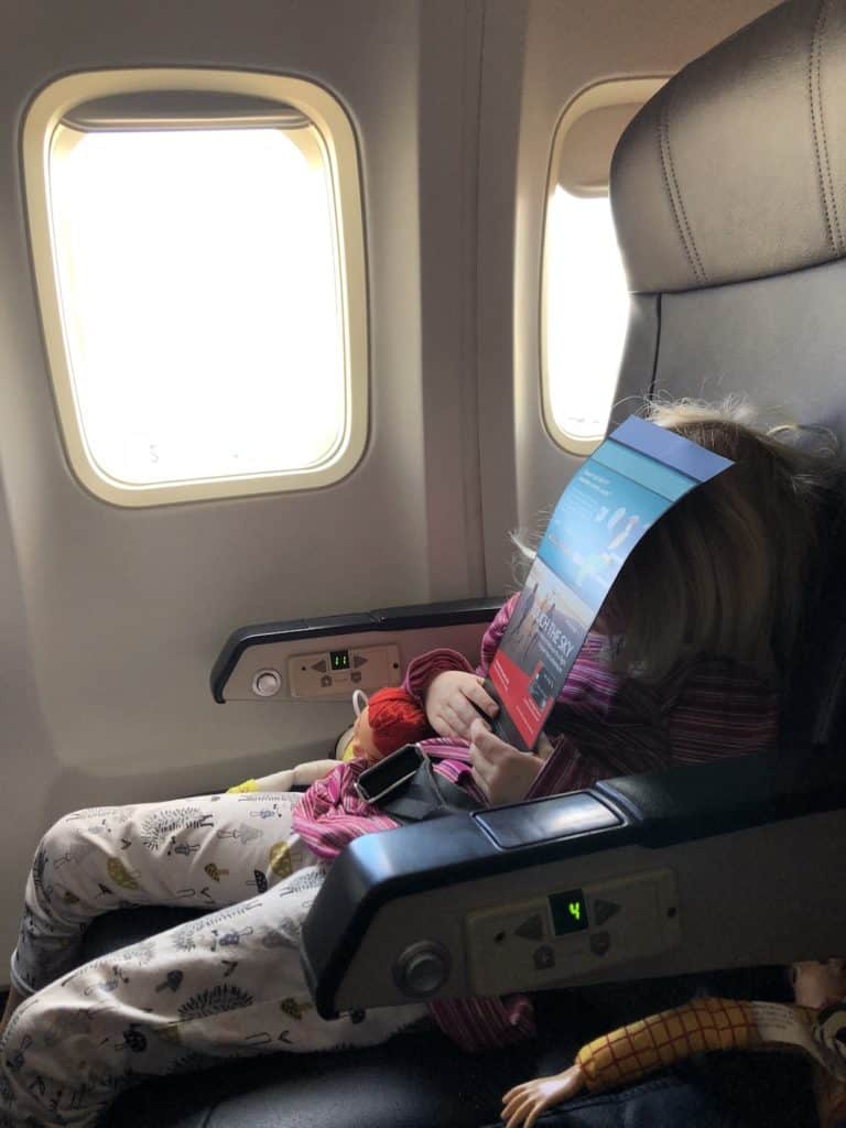 Napping on the plane: How to stay healthy when traveling with kids on the plane, plus other tips to fight germs on winter vacations! To & Fro Fam