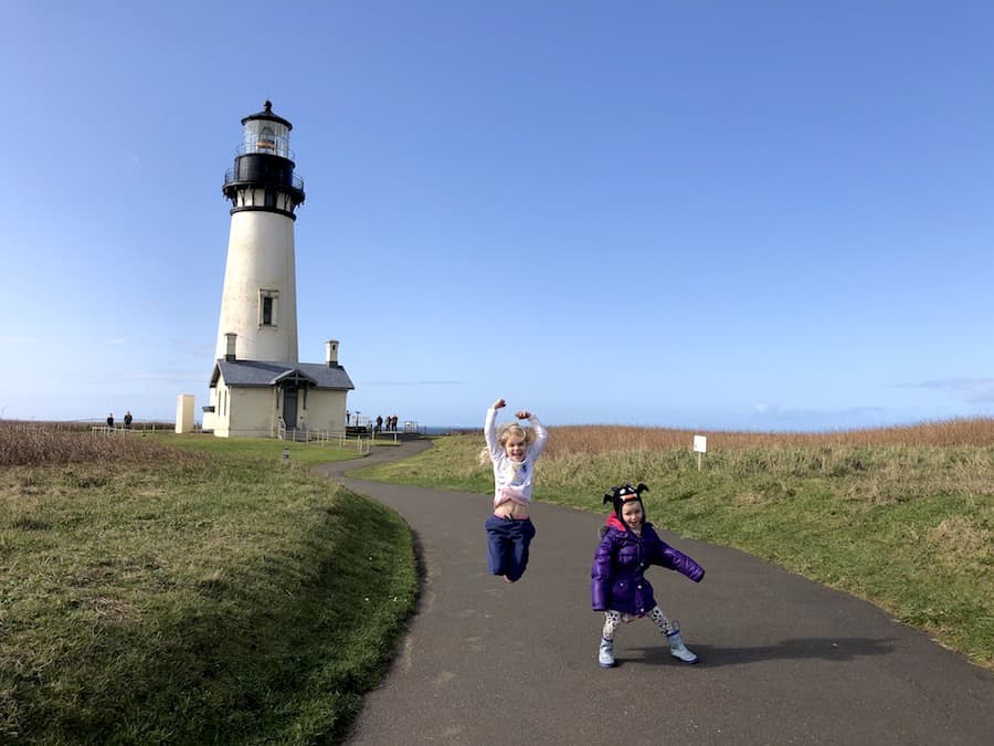 Yaquina Head Lighthouse on the Oregon Coast has tours, tide pools, unique beaches, whale watching and bird watching. A must-do activity near Newport OR! To & Fro Fam