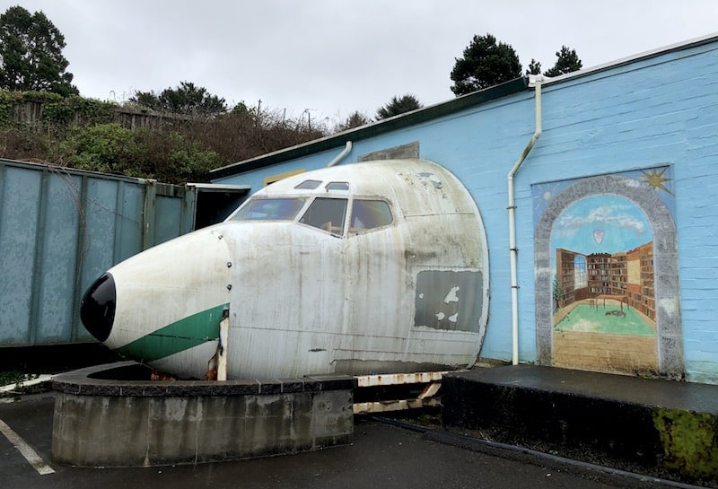 Weird + quirky things on the Oregon Coast: There's a plane coming out of this book shop in Lincoln City, OR! Click for more unique things to do in Lincoln City. To & Fro Fam