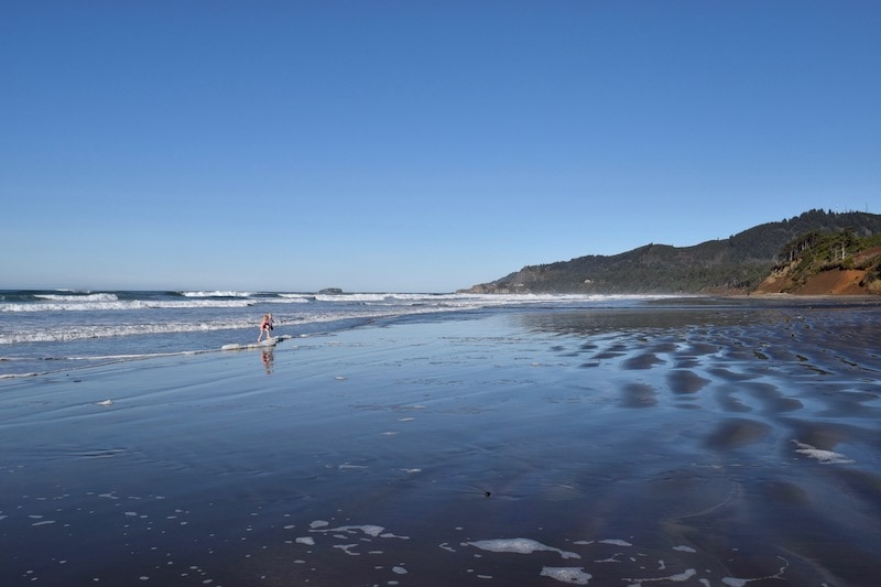 One of the best things to do on the Oregon Coast: Visit Beverly Beach State Park, where you can walk for ages along the sandy beach. Splash in the creek here and find fossils—so many fun things to do! To & Fro Fam