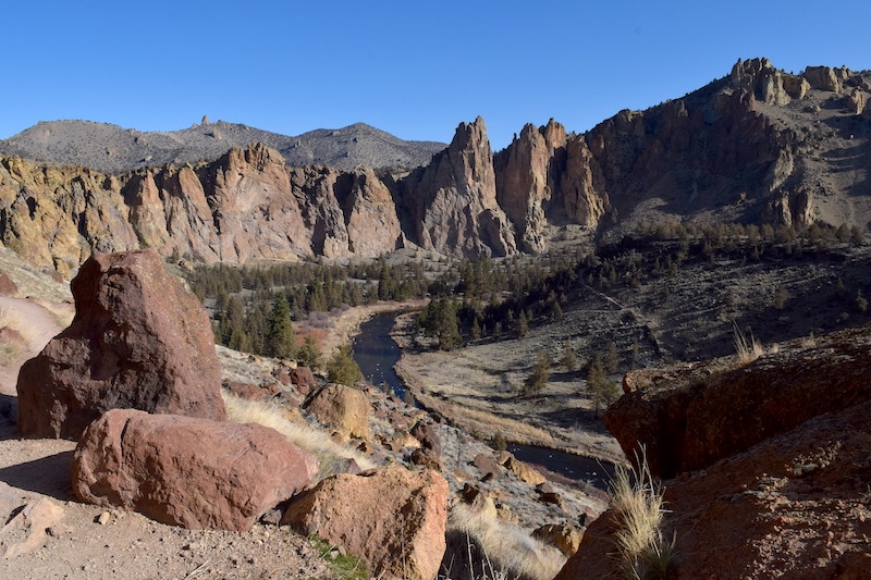 Misery Ridge: The most challenging trail in Smith Rock State Park. The huffing and puffing  up the switchbacks is worth it, though! Just look at this view. Click for more Smith Rock hikes and other things to do in this amazing park near Bend, OR. It's also a must-see stop on a Central Oregon road trip! To & Fro Fam