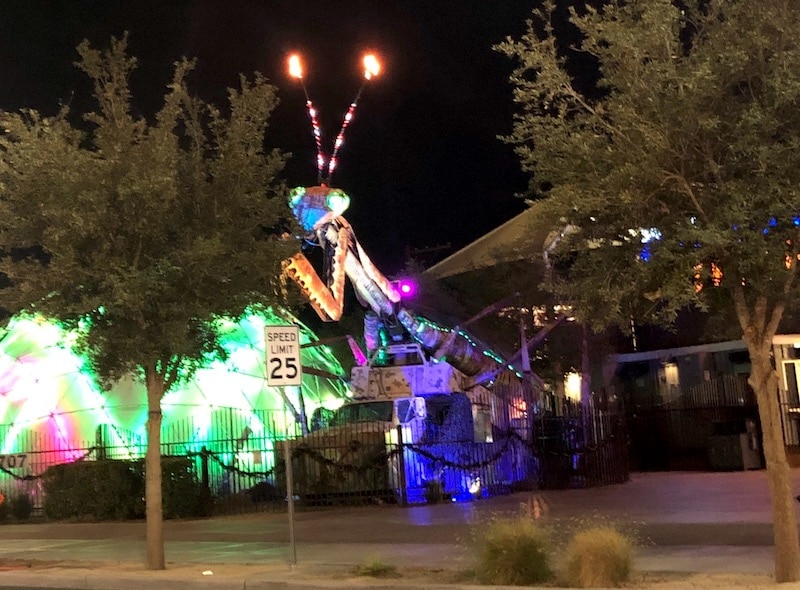 Container Park Las Vegas at night: praying mantis / To & Fro Fam